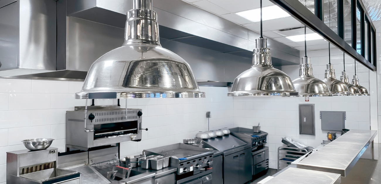 Large-scale commercial kitchen fitted with slip-resistant vinyl flooring for long-term performance