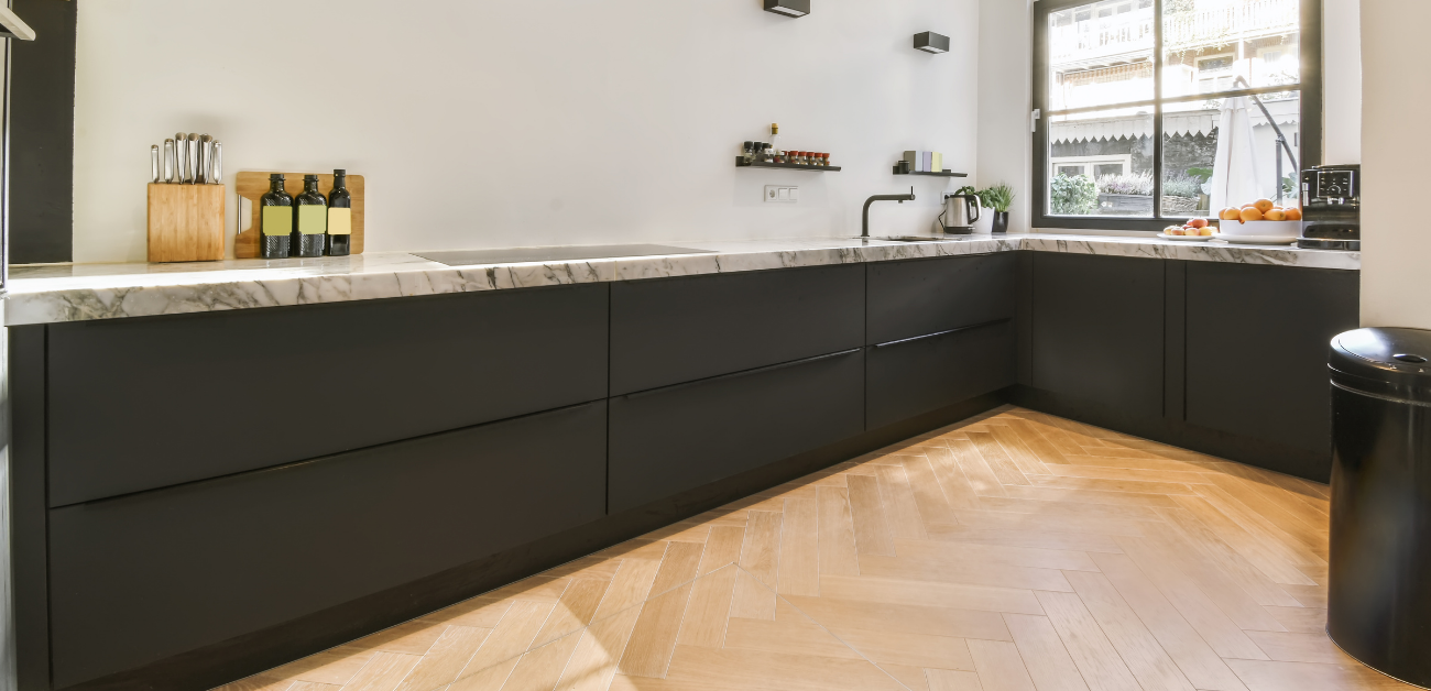 Modern commercial kitchen cabinetry and vinyl flooring designed for hygiene and safety compliance