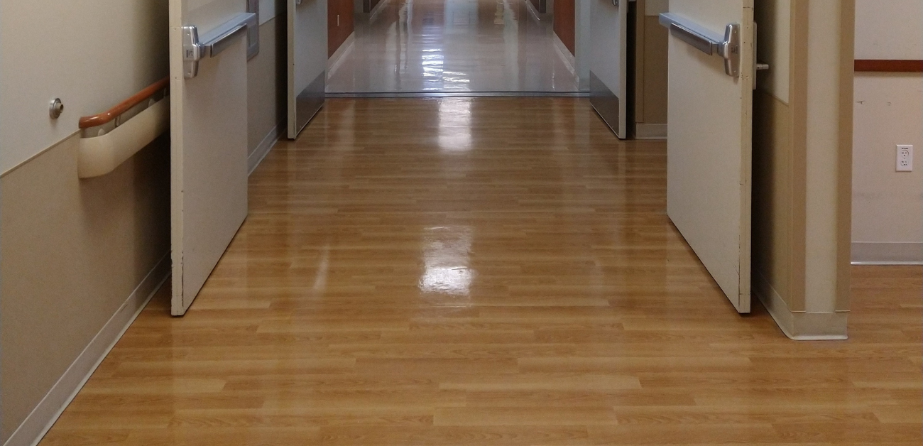 Hospital ward corridor with safety-focused vinyl flooring for high-traffic use