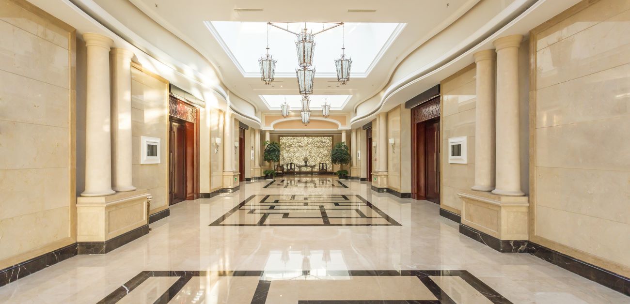 Hotel corridor and lobby transition space with coordinated feature wall finishes
