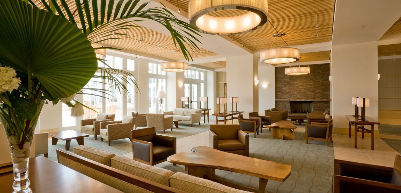 Modern hotel lobby interior showcasing feature wall materials and natural lighting
