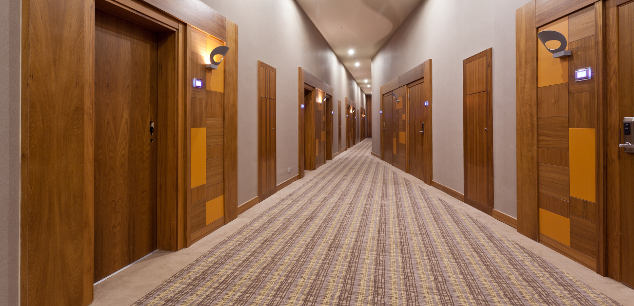 Hotel corridor fitted with heavy-duty carpet designed for high foot traffic