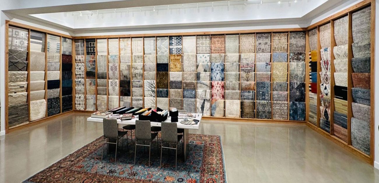 Large carpet showroom displaying hotel room carpet ranges for bulk supply
